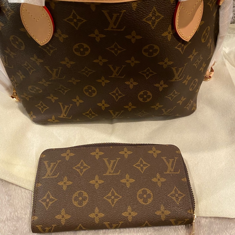 LV mirror wallet.  Never used